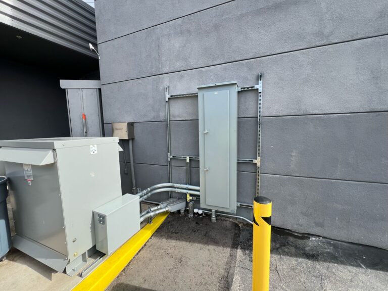 Completed EV charging station with parking spot markings visible.