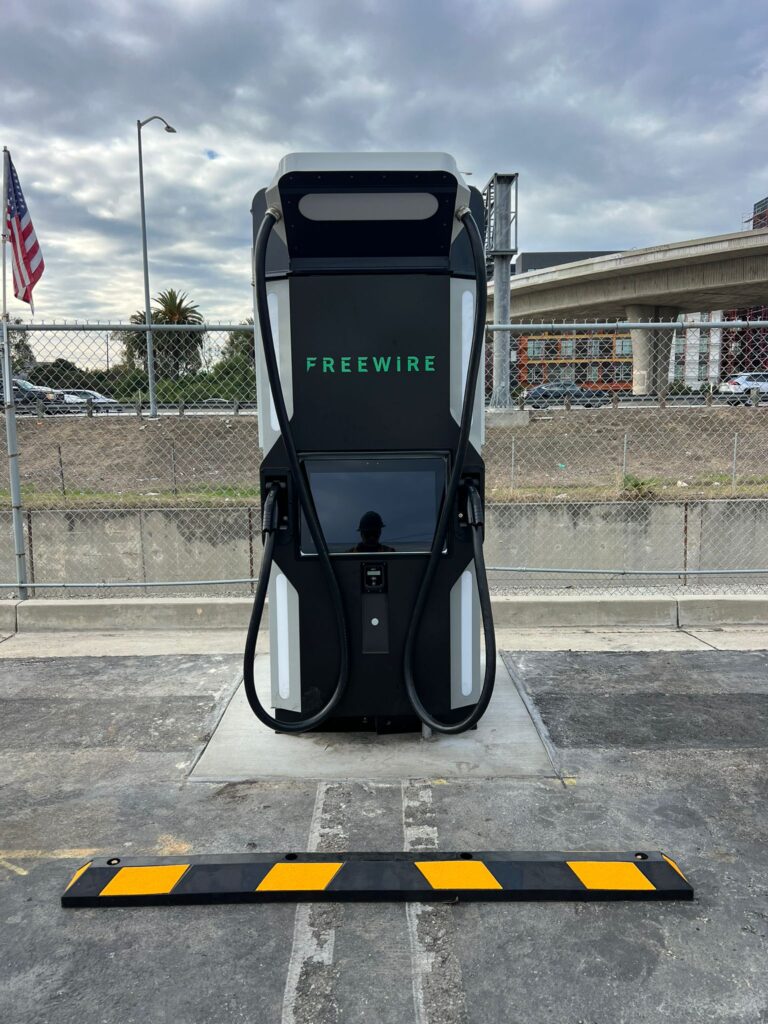 Vertical shot showing the electrical conduit and wiring path for the new EV chargers.