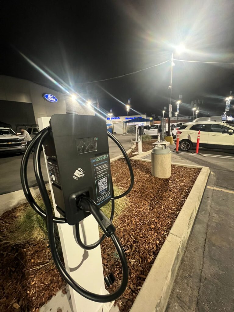 Vertical shot of a newly installed EV charger and its connection point.