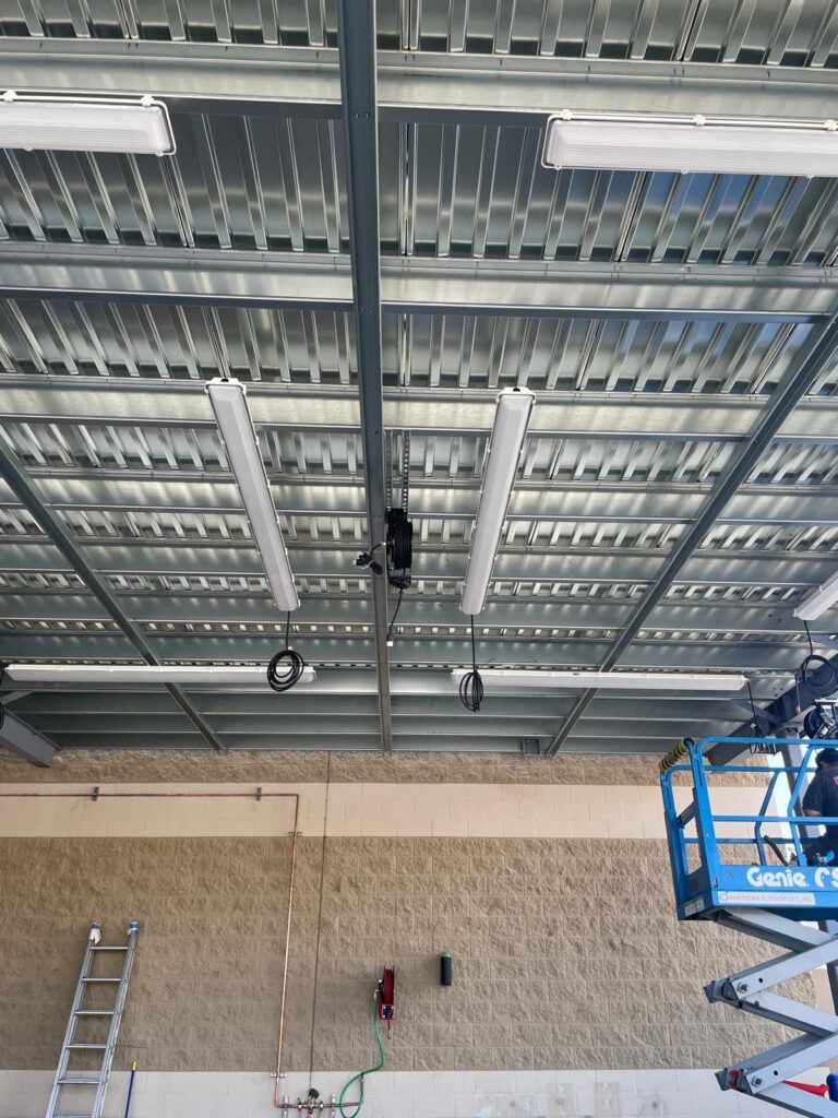 Electrical work and conduit installation for the Carmax solar and lighting upgrade.