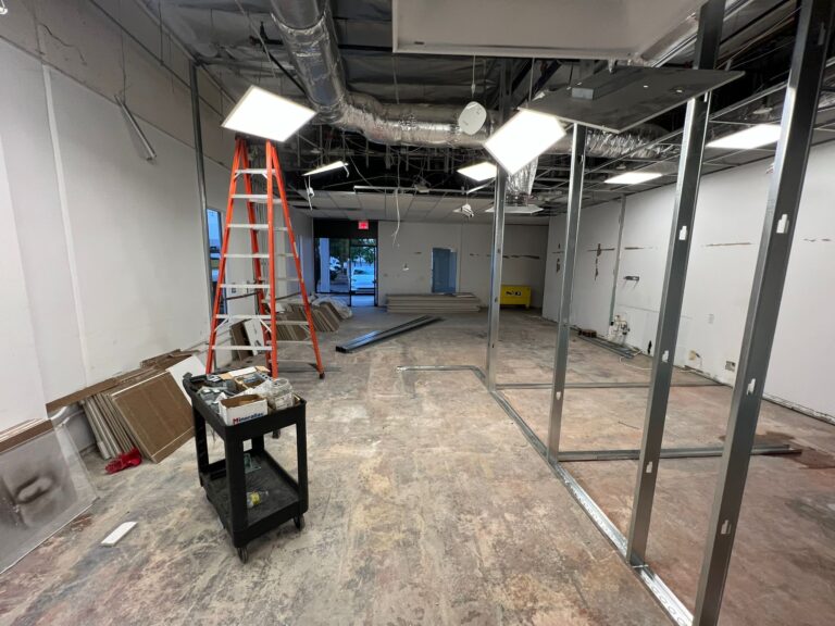 General view of the Tesla Service Center interior or electrical renovation area.